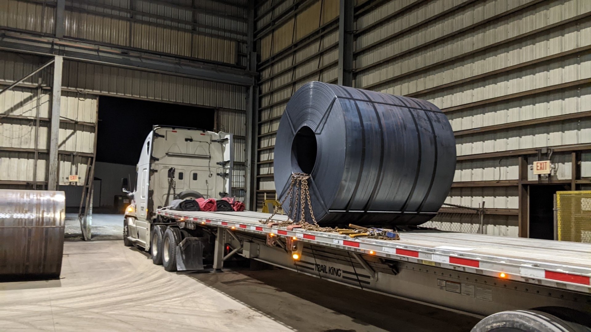 Steel coil chained to flatbed